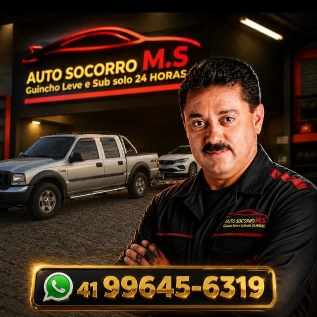 Equipe da Auto Socorro M.S em frente à base, com guincho e caminhonete